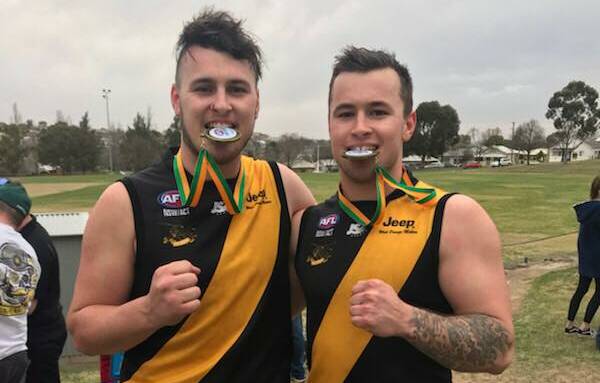 BROTHERS IN ARMS: Chris and Michael Rothnie after winning the Central West AFL grand final in 2018.