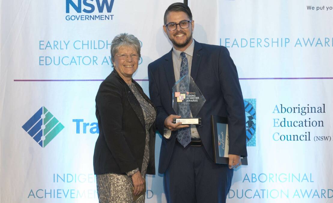 SPEECHLESS: Former Parkes boy Brenton Hawken who's now teaching in Temora, had no words when he accepted the NSW/ACT 7News Young Achiever Aboriginal Education Award from Chief Executive Officer Aboriginal Education Council Beverly Baker. Photo: Submitted