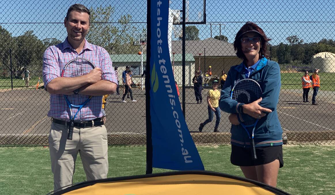 ON THE ROAD: Parkes Christian School principal Glen Westcott welcoming Tennis Australias ANZ Racquet Roadshow with Parkes tennis coach Helen Magill. Read more on the Racquet Roadshow next week. Photo: Submitted