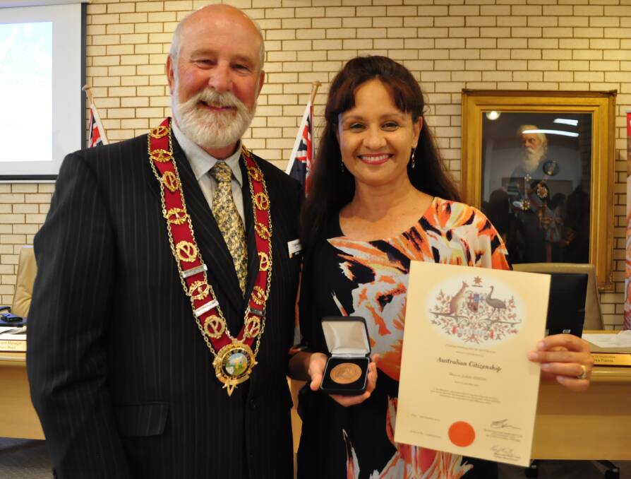 THANK YOU: Cr Ken Keith OAM took the opportunity at February's council meeting to present Sharon Dixon a Parkes medallion for her services to Parkes. Photo: Christine Little