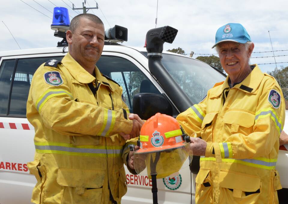 END OF AN ERA: Retiring RFS group captain for Area 1 in Parkes, Terry Job (right) has handed over the reins to Scott Baker, who is honoured to take on the role. Photo: Christine Little