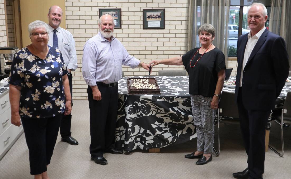 HAPPY BIRTHDAY: Parkes councillors Pat Smith, Alan Ward, Mayor Ken Keith OAM and Deputy Mayor Barbara Newton and general manager Kent Boyd cutting the birthday cake. Photo: Submitted
