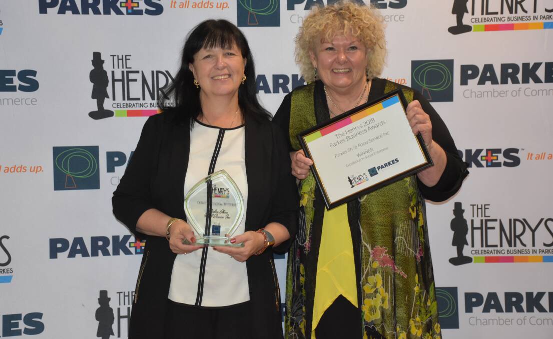 Gill Kinsela and Deborah Wren from Parkes Shire Food Service Inc (Meals on Wheels) with their Excellence in Social Enterprise award at the 2018 Henrys - Parkes Business Awards.
