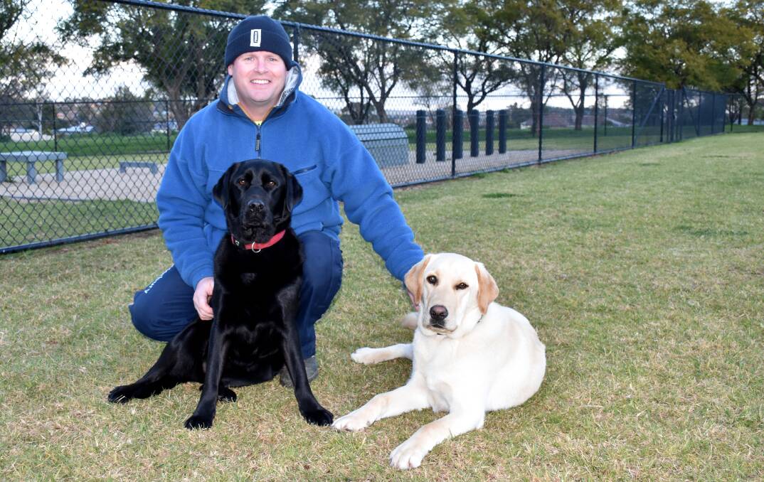 VISIT TO THE DOG PARK: Colin Boggs with Pepper and Salt at Parkes' new dog park at Kelly Reserve. Photo: Jenny Kingham