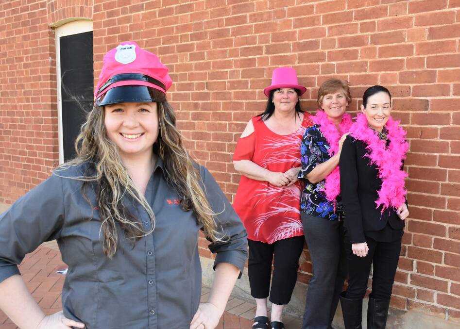 PINK POLICE: Parkes Champion Post editor Christine Little will be on pink patrol in October, making sure staff Wendy Allen, Joanne Simpson and Tara Barber are wearing pink.