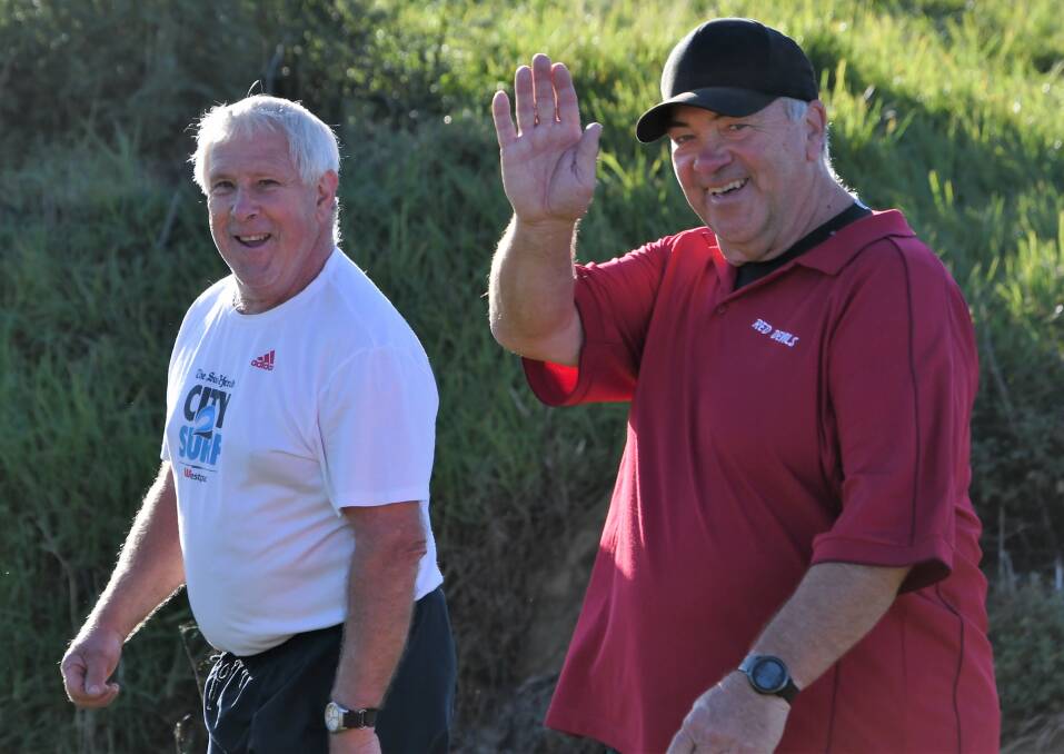 OUT FOR A STROLL: Tim Keith and Tony Melhuish smile for the camera when they took part in a recent Parkrun around Northparkes Oval. Photo: Jenny Kingham