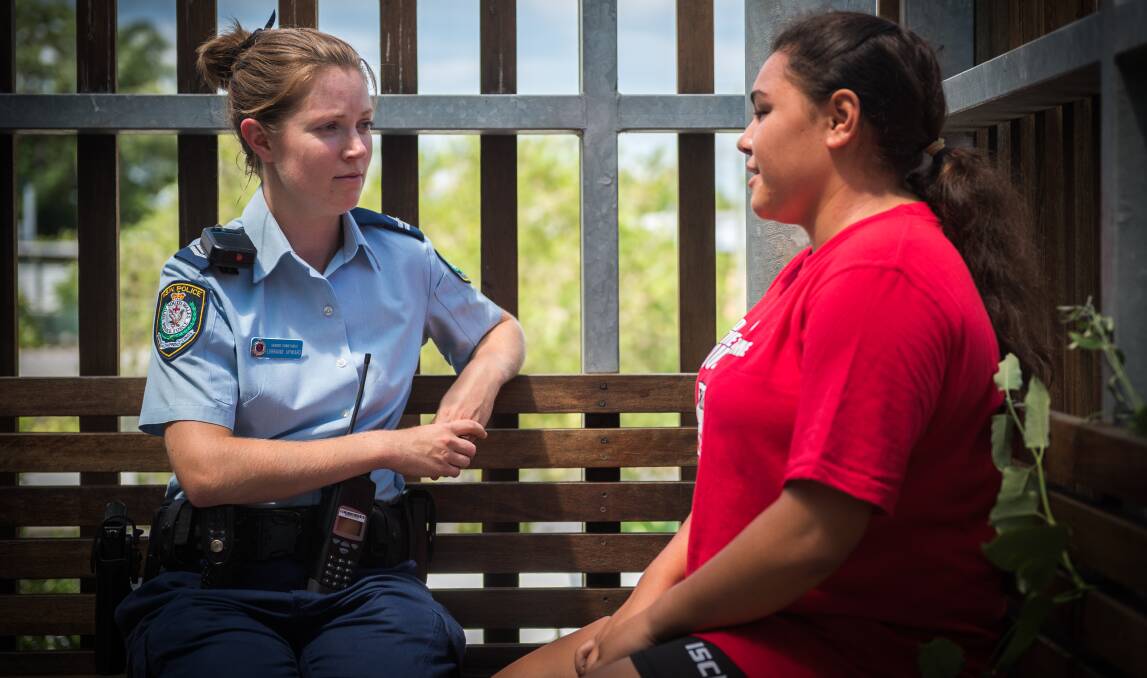 Senior Constable Lorraine Upward with a youth. Photo: File photo
