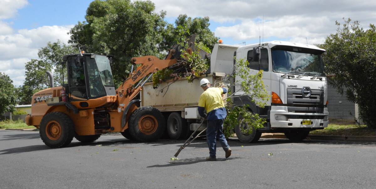 CLEAN UP: Parkes Shire Council workers hard at work cleaning up Thornbury Street on Saturday afternoon.