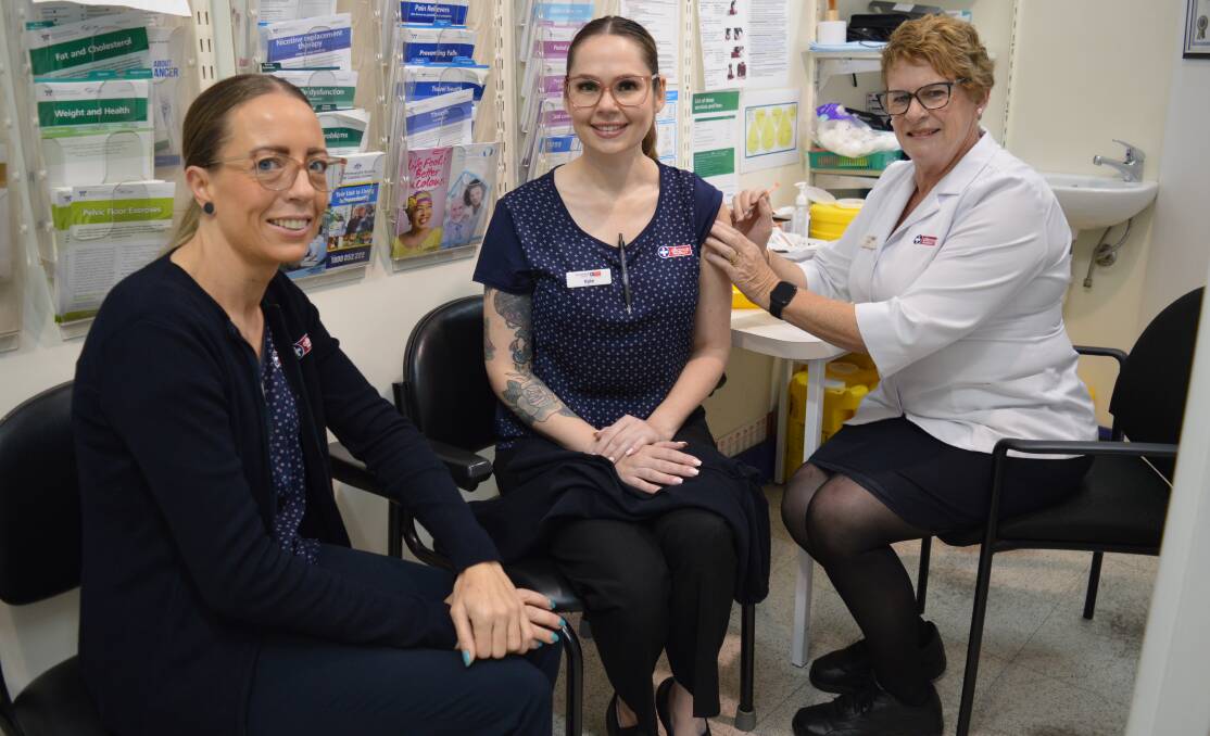 FREE FOR ALL: GPs and pharmacies, like Ron Dunford Chemist, will be offering free flu vaccinations in June. Pictured are staff Tash Butt and Kyla Budd with pharmacist Arna Jasprizza. PHOTO: CHRISTINE LITTLE