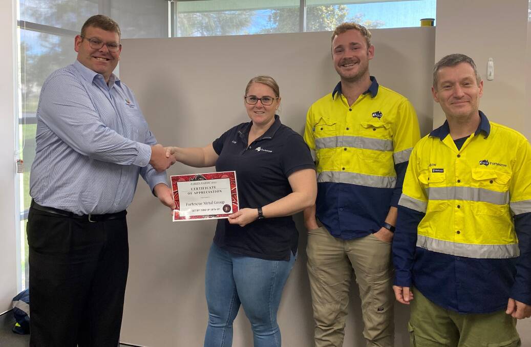 Neighbourhood Central Aboriginal Project Officer Micheal Anderson thanks Elise Jackson, Jason Scouropoulos and Taylor Ogden from Fortescue mining for the organisation's enormous contribution during the day. Picture supplied