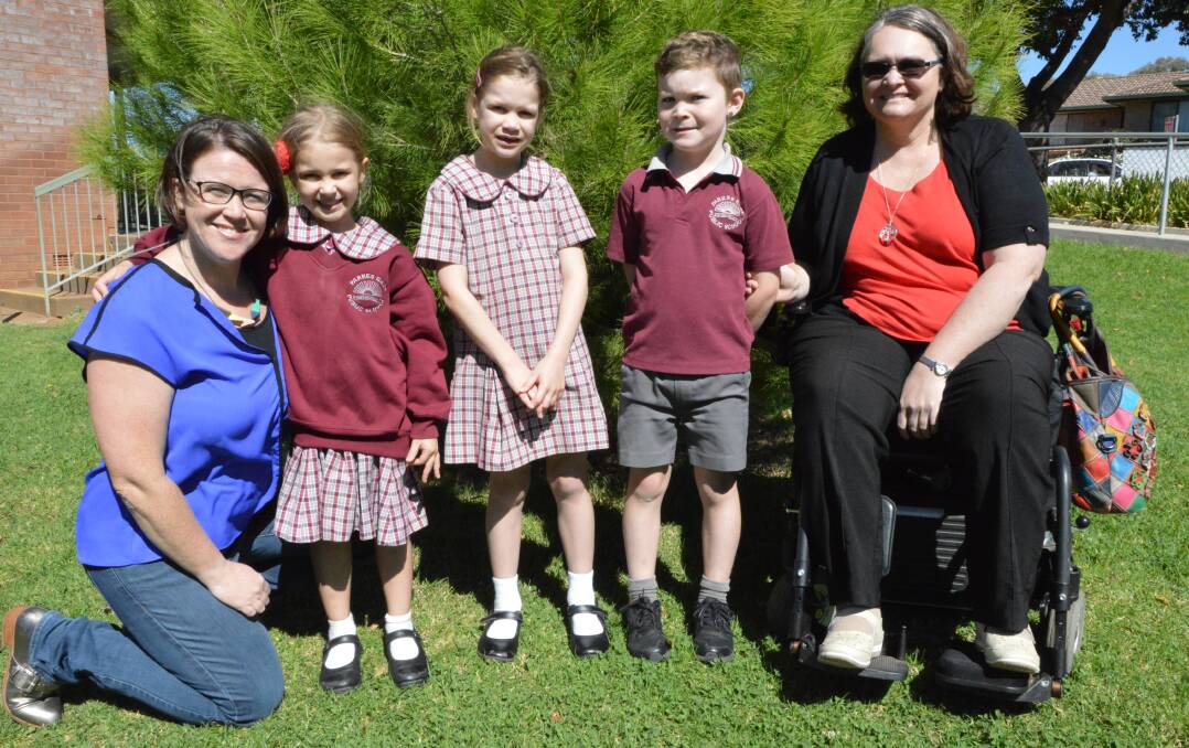 FOCUS ON ETHICS: Ethics teachers Fiona Francis (left) and Tracey Ross (right) with Parkes East Public School students Sophie (kindy) and Caitlin (Year 2) Francis and Toby Ross (Year 1). Photo: Christine Little