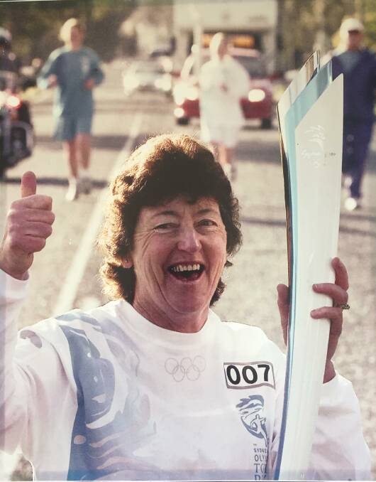 TIME TO RELAY: Maureen Massey was full of adrenaline when it came her time to carry the Olympic flame in Cowra on August 18, 2000. Photo: Submitted