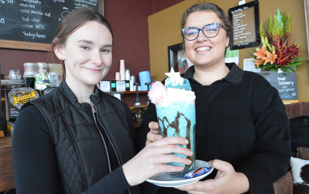 OUT OF THIS WORLD: Julia Maher and Laura Morcom-Taylor from Deja Brew in Parkes with the galaxy freakshake that's available until July 31.
