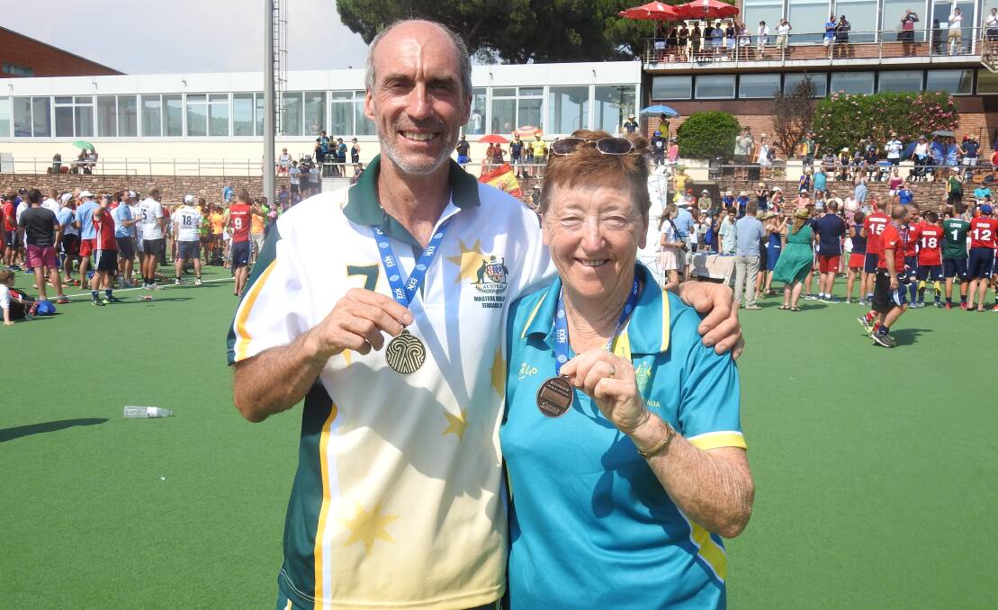 PROUD: Two proud Parkes and Australian representatives, Graeme Tanswell and Maureen Massey, following their medal presentations at the Masters Hockey World Cup in Barcelona, Spain. Photo: Submitted