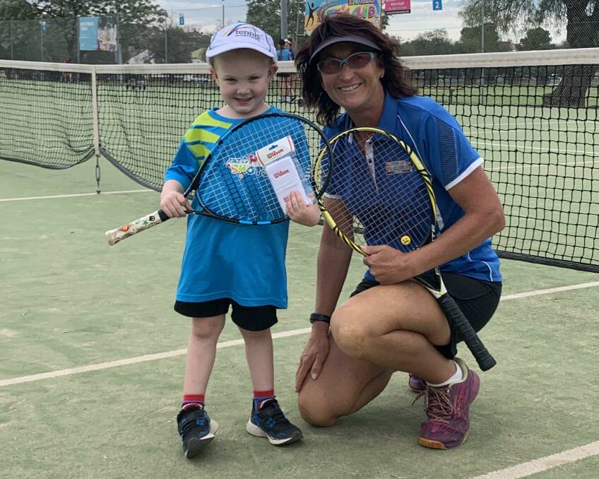 ALL SMILES: HotShots Happy Box winner was Lucas Jones, with Parkes coach Helen Magill. Photo: Submitted