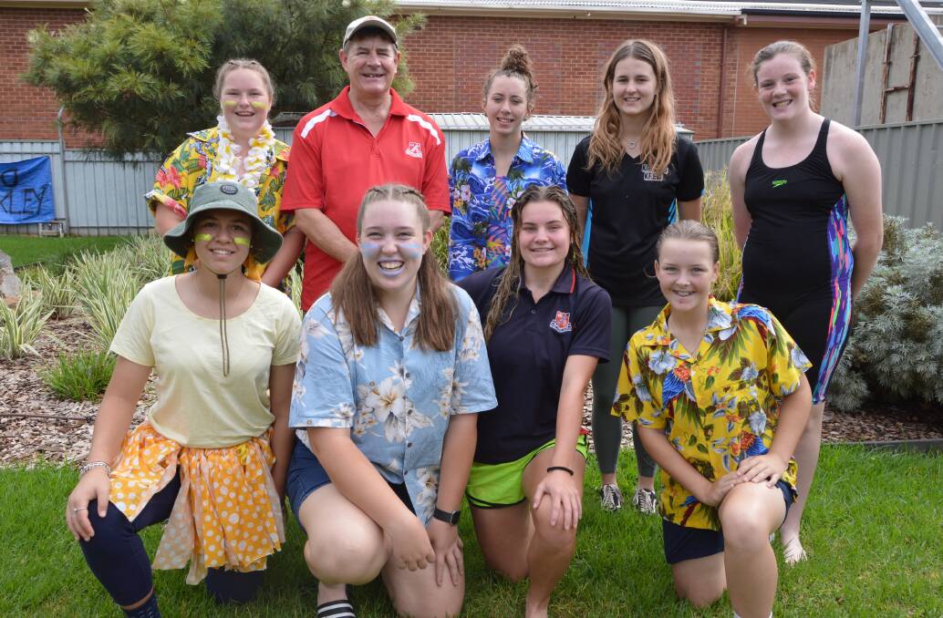 TOP FOUR: Back, Olivia Thompson, Mr Kieran Duncan, Jordan Moody, Holly McColl and Holly Duncan; front, Teagan Smede, Jolie Norman, Abi Simpson and Maddy Spence, all winding down after their big win at the Parkes High School swimming carnival on Thursday. Absent - Tess Woods, Gracie Jones and Julia Dunn. Photo: Christine Little