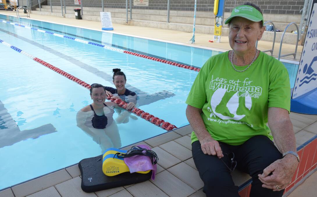 BIGGEST SUPPORTERS: While Suzie Hill swam 600 laps of the Parkes Pool, friend Janelle Goodsell joined her when she could in support, and Suzie's mum Cathy Billiards walked 100km, meeting up with her daughter at the pool to witness her final laps. Photo: Christine Little