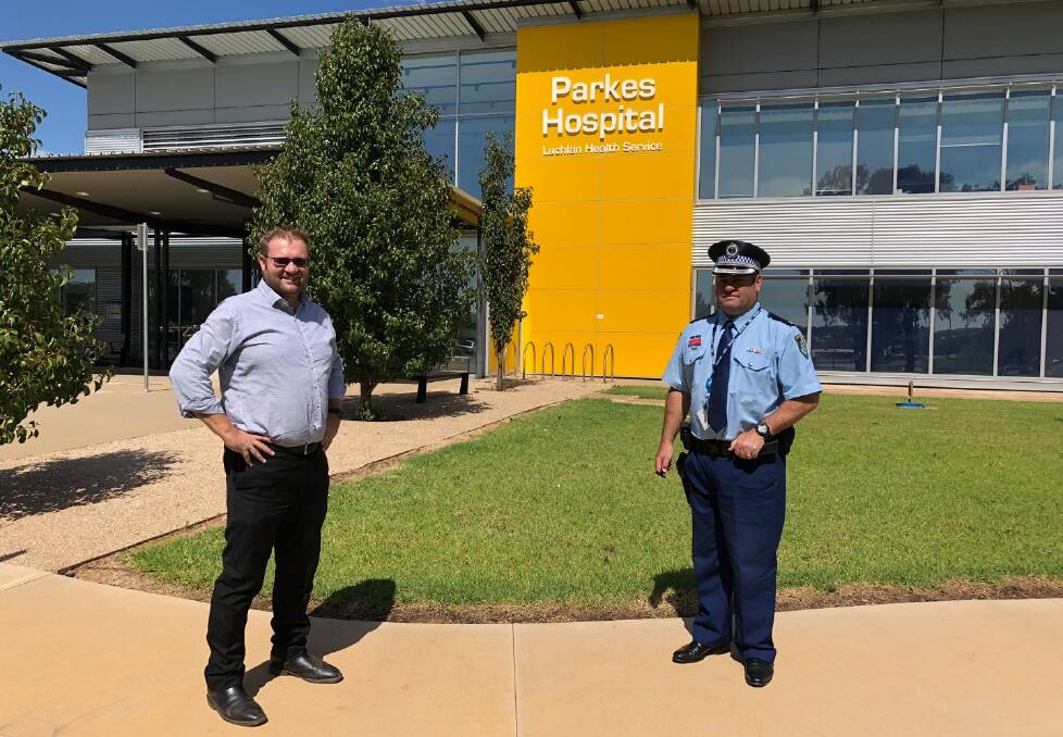 PARKES PREPARED: Parkes Shire Council's Director Infrastructure Andrew Francis with Parkes Police Chief Inspector Dave Cooper social distancing outside the Parkes Hospital. Photo: Supplied