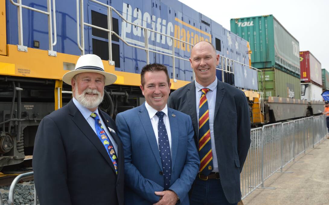 TERMINAL OPENING: Parkes Mayor Ken Keith OAM joined NSW Minister for Regional Transport and Roads Paul Toole and Parkes Chamber of Commerce president Geoff Rice at the Pacific National terminal opening on October 30. Photo: Barbara Reeves