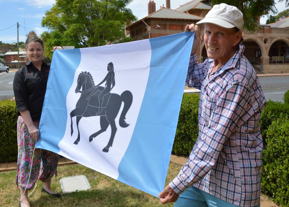 INTERNATIONAL RELATIONSHIP: Coventry man Ron Finnerty, 81 - pictured with Champion Post editor Christine Little - and his city's official flag arrived in Parkes almost at the same time. Photo: Barbara Reeves