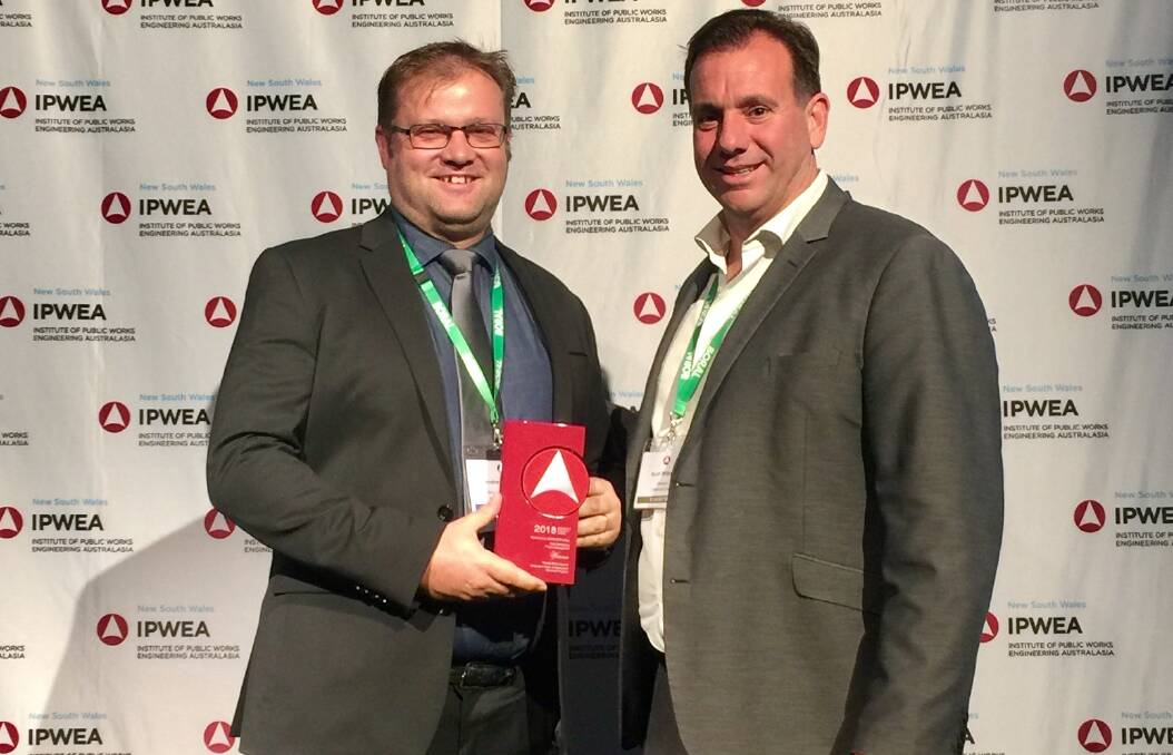 BIG WIN: Parkes Shire Council's Director of Infrastructure Andrew Francis accepts the award for Project Management from Managing Director of COMPLETE Urban Scott Williams, at the 2018 Institute of Public Works Engineering Australasia conference.