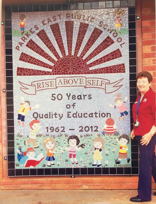 HIGHLIGHT: Maureen Massey made the giant mosaic mural for the school's 50th anniversary in 2012 that takes pride of place on the front wall facing Thornbury Street. Photo: Submitted