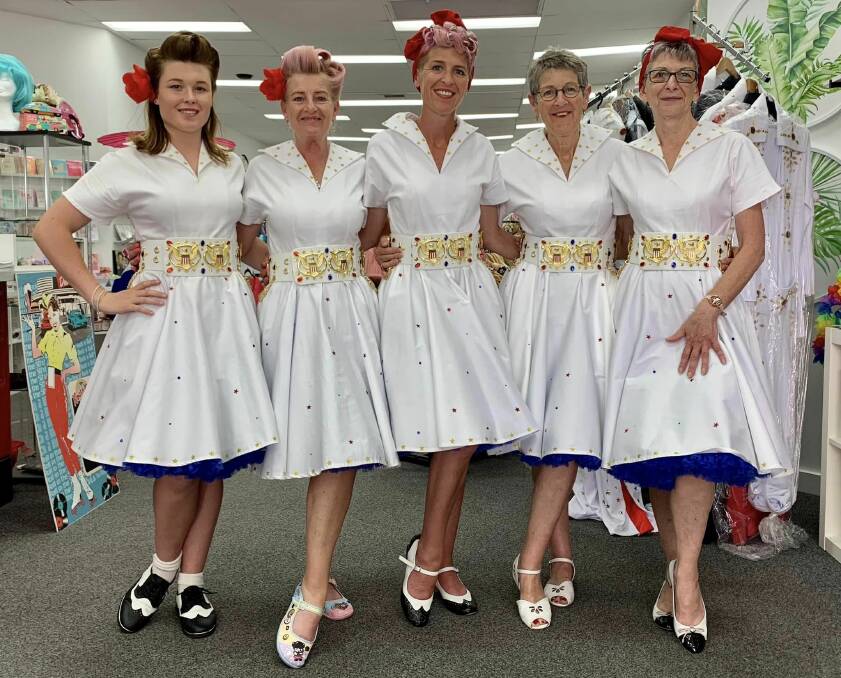 The Colouby Creations team of Pascal Berry, Keily Baker, Kristy Berry, Deanna Kennedy and Debbie Barrett in their impressive handmade white Elvis jumpsuit style dresses with specially designed belts from the UK. Picture supplied