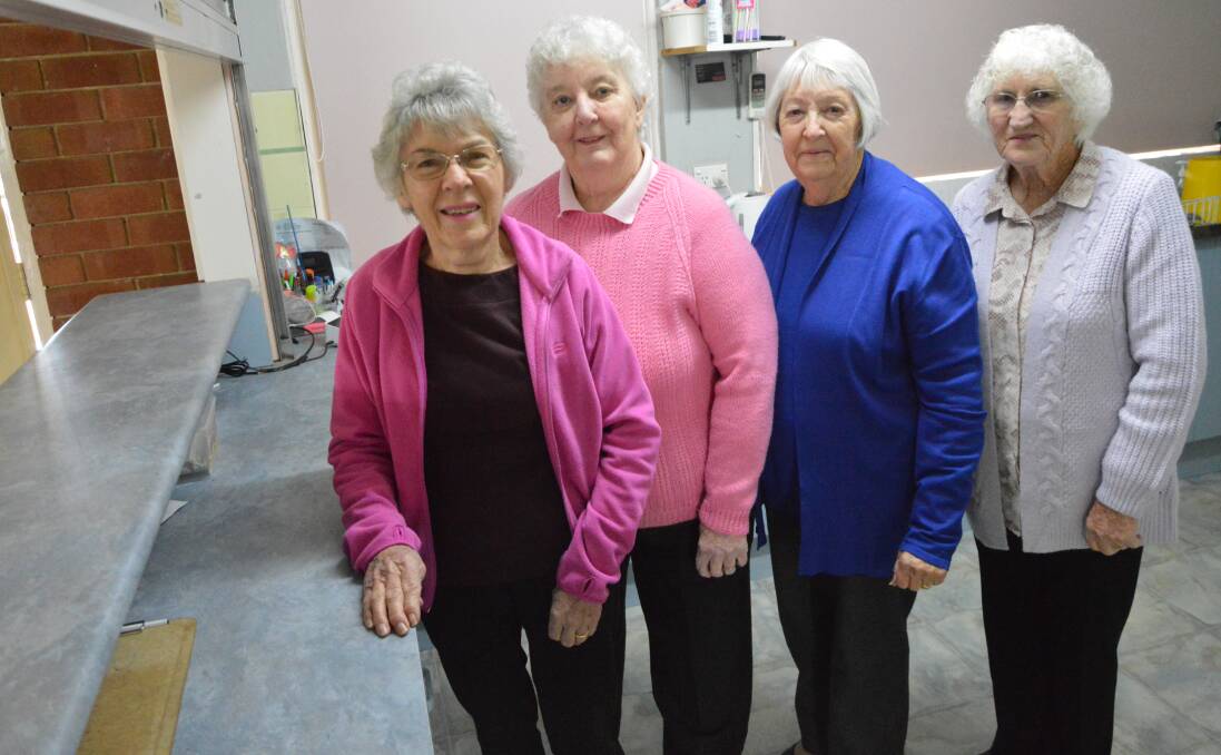 WHAT A TEAM: Val Glasheen, Pat Drabsch, Lynette Pengilly and Pauline Nicholson have volunteered in the Parkes Tennis Centre's canteen for almost 40 years. Pat and Pauline have decided to call it a day. Photo: Christine Little