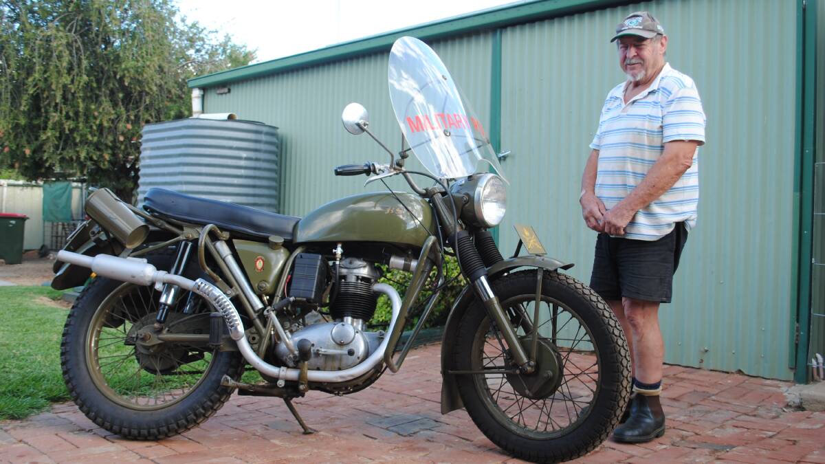 PROUD AS PUNCH: Parkes Shire Councillor, and Central West Car Club member George Pratt, has restored a 1960 Military Escort Bike. Photo: Supplied.