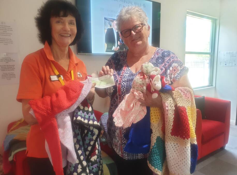 MAKING A DIFFERENCE: Orange Ronald McDonald House volunteer Elaine Curll was delighted to receive the donation from president of Parkes College Seniors Group Denise White at Ronald McDonald House in Orange. Photo: Submitted