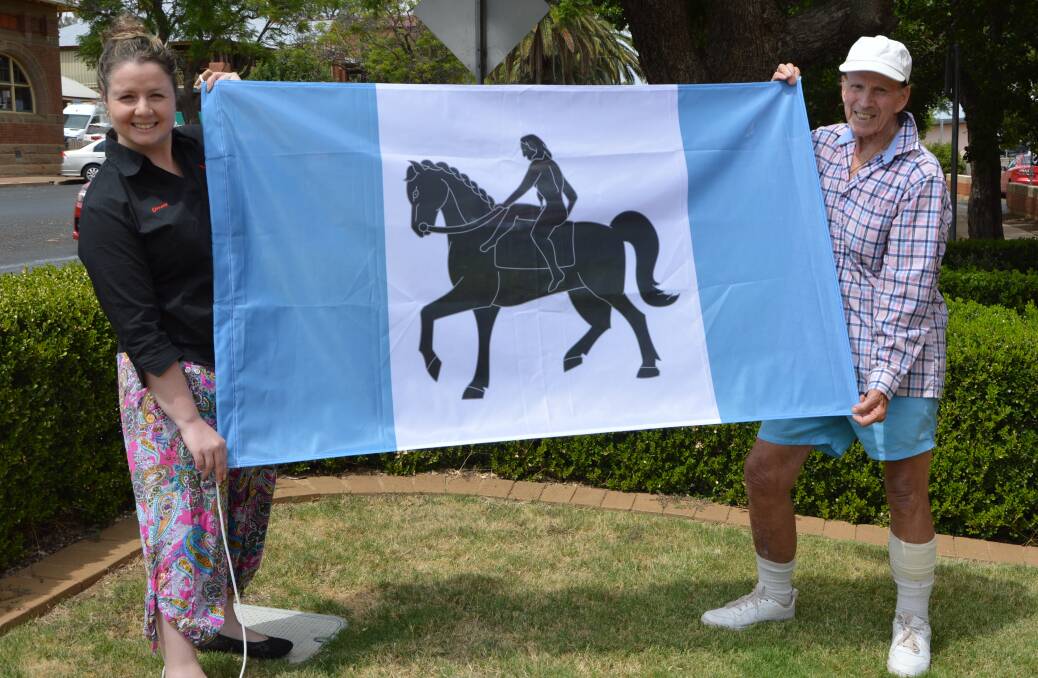 PARKES VISITOR: Coventry man Ron Finnerty, 81, pictured with Parkes Champion Post editor Christine Little with the Coventry flag at the end of February. Photo: Barbara Reeves