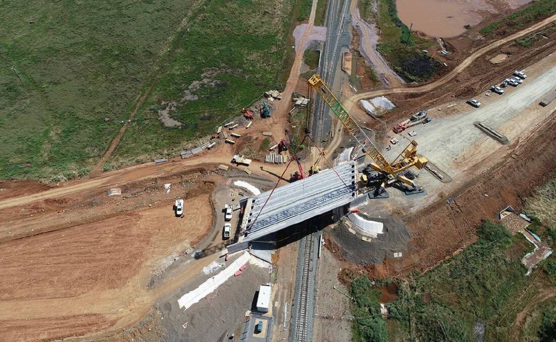 Two bridges over railway lines are being constructed in Brolgan Road to accommodate the Parkes Special Activation Precinct. Photo by NSW Government