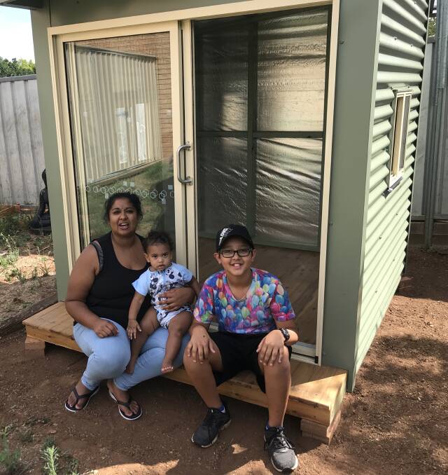 PLAY TIME: Parkes family Sarea, Nate and Ryder Vidler with the Parkes Rotary Club's cubby house, kindly donated to them and installed at their home by local business Potts Removals. Photo: Submitted