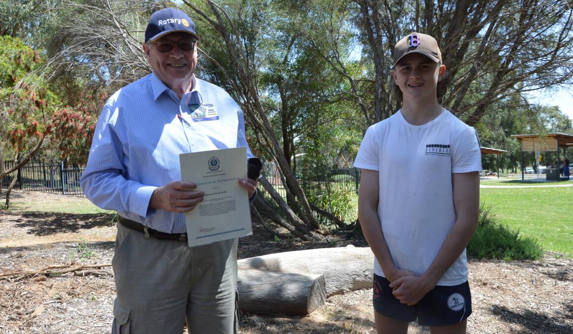 THANK YOU: Baiden Forster from Forbes thanked Parkes Rotary Club for the day at the Rotary Peace Precinct, presenting secretary Ken Engsmyr an appreciation certificate. Photo: Christine Little