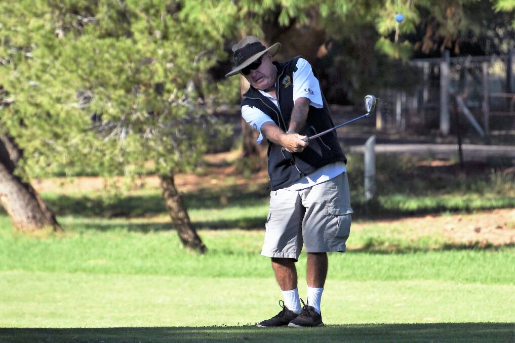 HIT IT: Parkes golfer John Davies is a regular on the Parkes golf course, here he is spotted when it was a bit warmer. Photo: Jenny Kingham