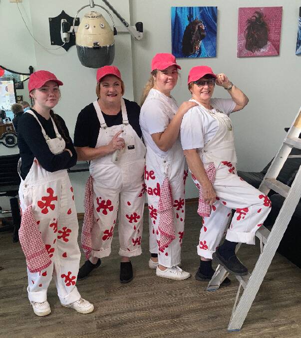GREAT EXAMPLE: Emily Littler, Debbie Winter, Jacinta Knowles and Janice Cassidy from Janice Cassidy's Hair Salon supported the Parkes Elvis Festival 'Speedway' theme and Paint The Town REaD in these famous overalls this year. Photo: SUPPLIED