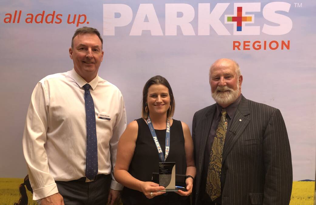 SERVICE: Jane Howard was presented an award marking her 10 years of service at Parkes Shire Council's January meeting. She's pictured with her manager chief operations officer Anthony McGrath and Mayor Ken Keith OAM. Photo: Christine Little
