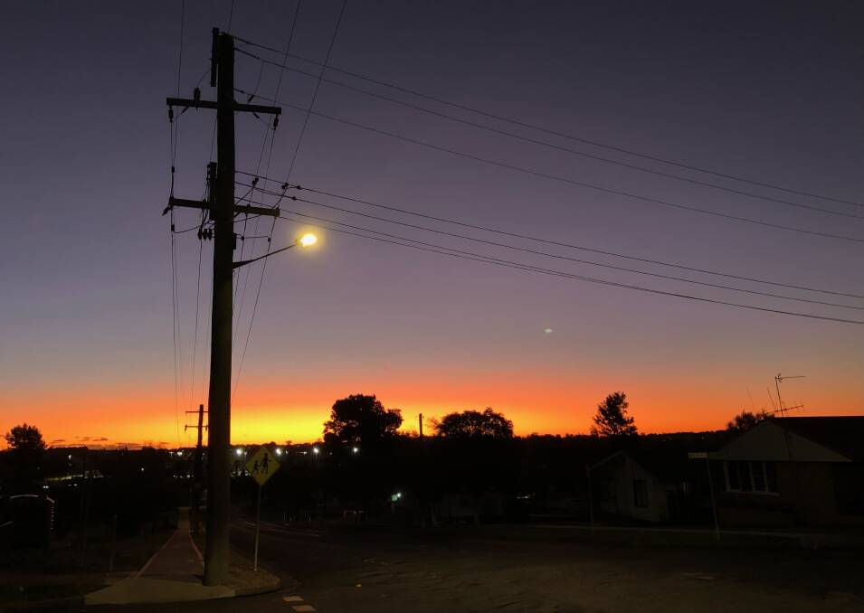 CALM AFTER THE RAIN: Last Friday's sunset taken in Medlyn Street, looking west, at 6pm. Photo: CHRISTINE LITTLE