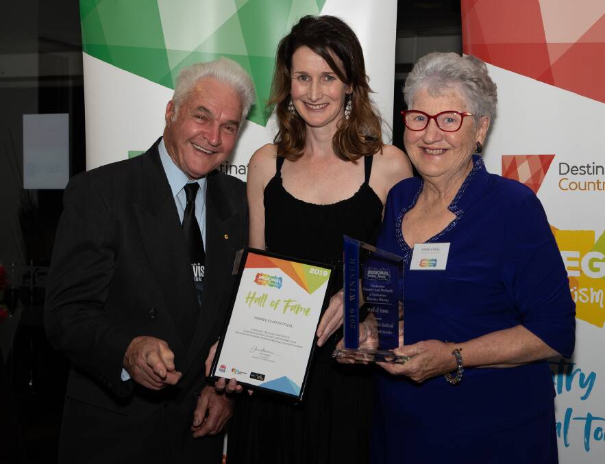 THE WONDER OF THE FESTIVAL: Parkes Elvis Festival Director Cathy Treasure (centre) was honoured to accept the Regional Tourism Hall of Fame accolade with festival founders Bob and Anne Steel on Saturday night. Photo: Submitted