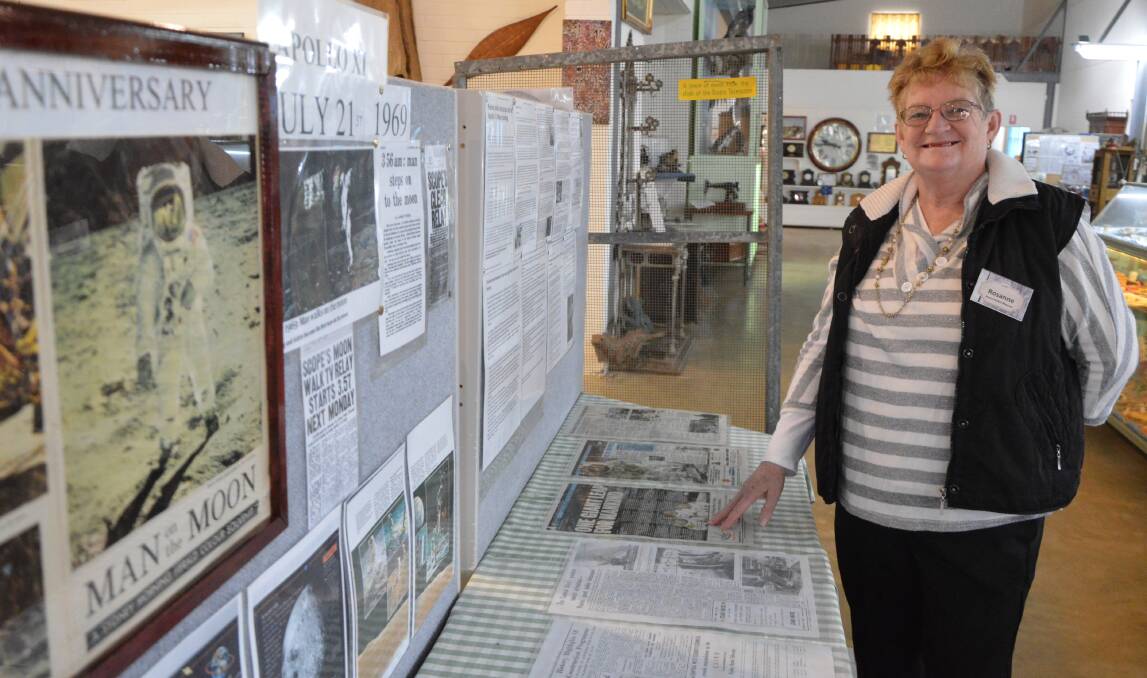ON DISPLAY: Parkes and District Historical Society secretary Rosanne Jones with the Apollo 11 moon landing 50th anniversary display, which includes an original panel of the Dish (in the background) at the Henry Parkes Museum.