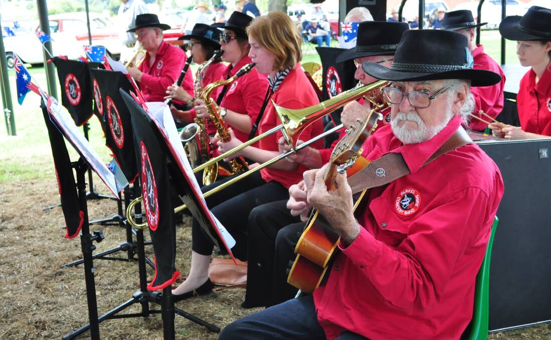 BANDING TOGETHER: The Parkes Shire Concert Band - pictured performing on Australia Day this year, with Doug Richards in front - will join the South Pacific Concert Band this weekend to bring a Spring into Summer Concert Band Spectacular to town. Photo by Christine Little