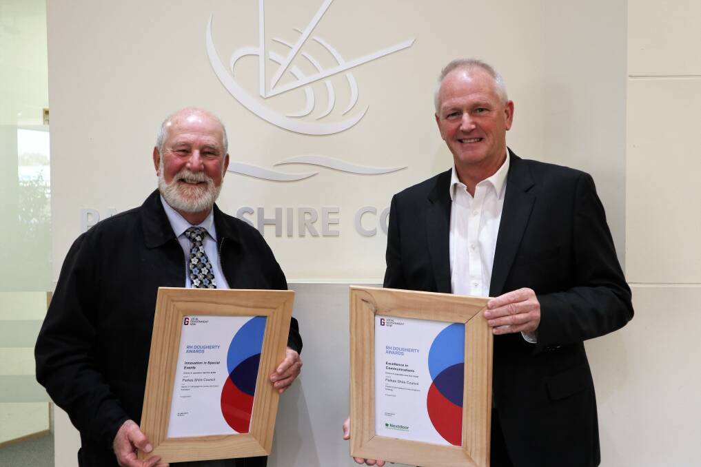 DOUBLE WINNER: Parkes Mayor Ken Keith OAM and Parkes Shire Council general manager Kent Boyd with the two awards won at the 2020 Local Government Week RH Dougherty Awards. Photo: Submitted