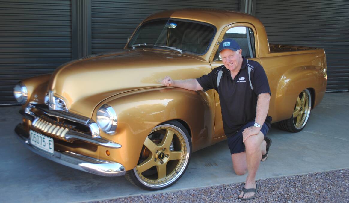 PURE GOLD: Ian Rousell with the spectacular FJ Holden ute. The ute was built about 20 years ago on the NSW Central Coast. Photo: Jeff McClurg