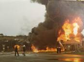 One of the many frightening scenes of what could have been a very devastating fire at the Mobil fuel depot in East Street on the rail line on May 23, 1983.