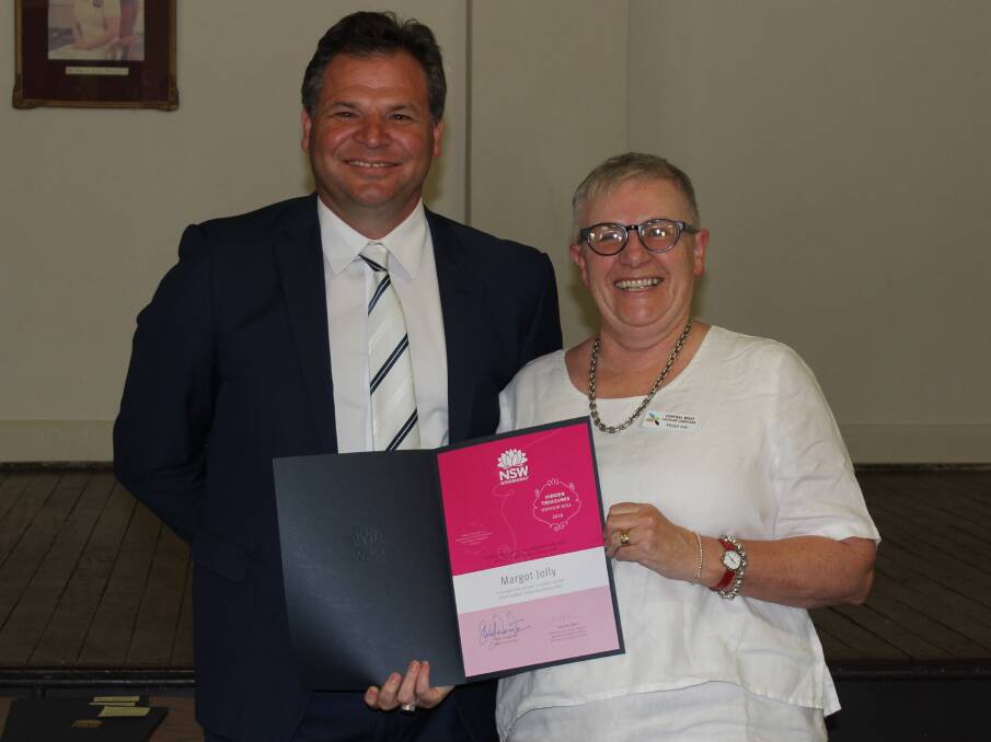 PRESENTATION: Phil Donato congratulated a deserving Margot Jollie of Parkes. Photo: SUBMITTED