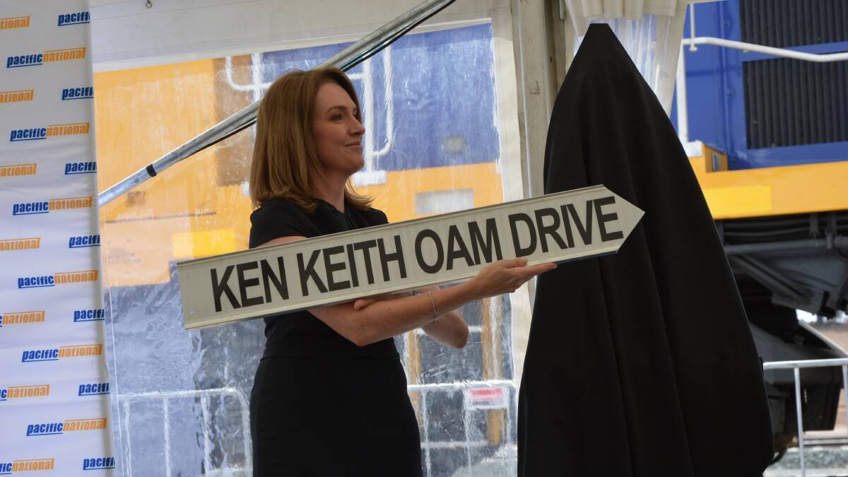 UNVEILING: Hiding behind the black sheet with the official opening plaque was a special surprise for Parkes Mayor Ken Keith OAM, a road sign with his name on it.