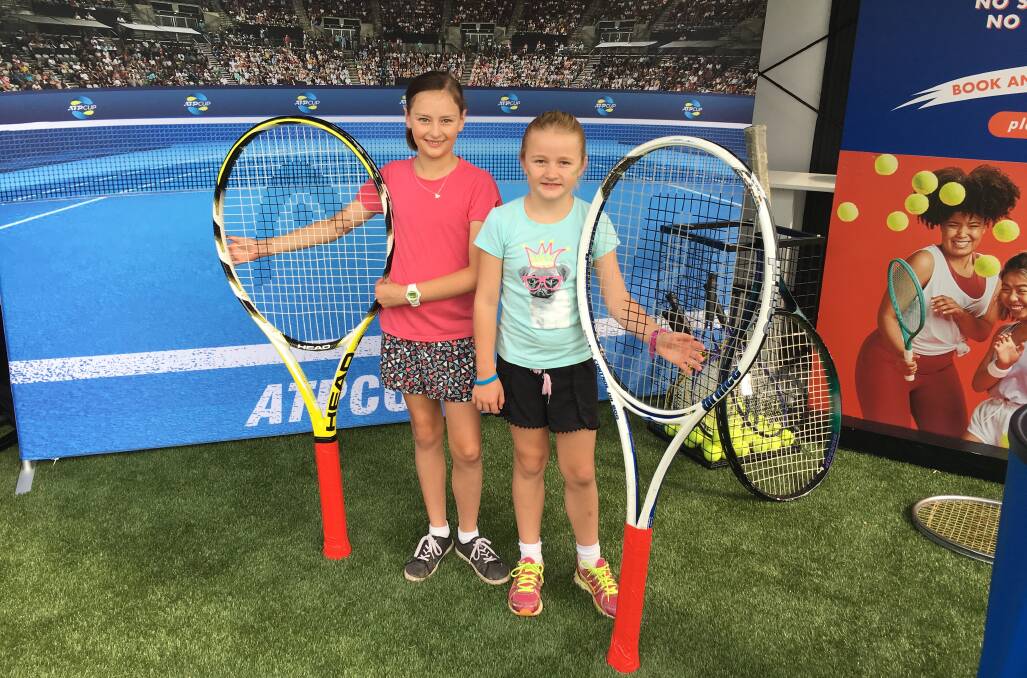 ATP CUP: Elena Glastonbury and Anna Davis trying out the oversized racquets at ATP Cup in Sydney. Photo: Submitted