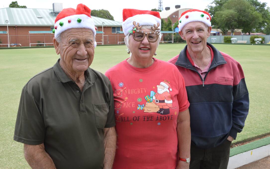 CHRISTMAS SPIRIT: Party organisers John Carr, Julie Green and Graham Lancaster from the Parkes Uniting Church are inviting anyone hurting from the drought to join them for a Christmas party and dinner. Photo: Christine Little