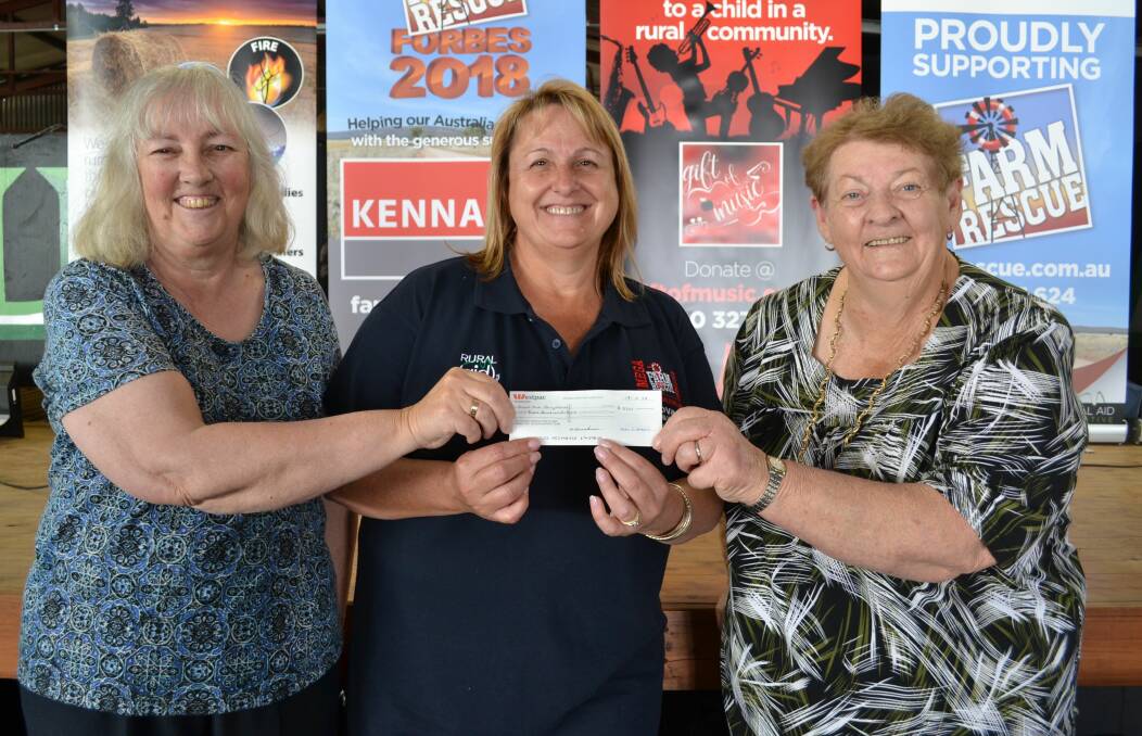 APPEAL: Kerry Buerckner (treasurer), Tracy Alder (Co-Founder Rural Aid) and Marilyn Pizarro (president) at the cheque presentation. Absent is Sue Stibbard.
