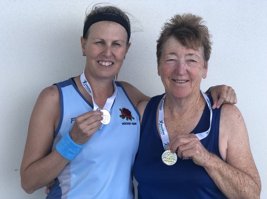 WHAT A WEEK: Parkes master hockey players Denise Gersbach and Maureen Massey returned home from the 2019 Women's National Championships on the Gold Coast with gold and silver medals, and an Australian selection. Photo: Submitted